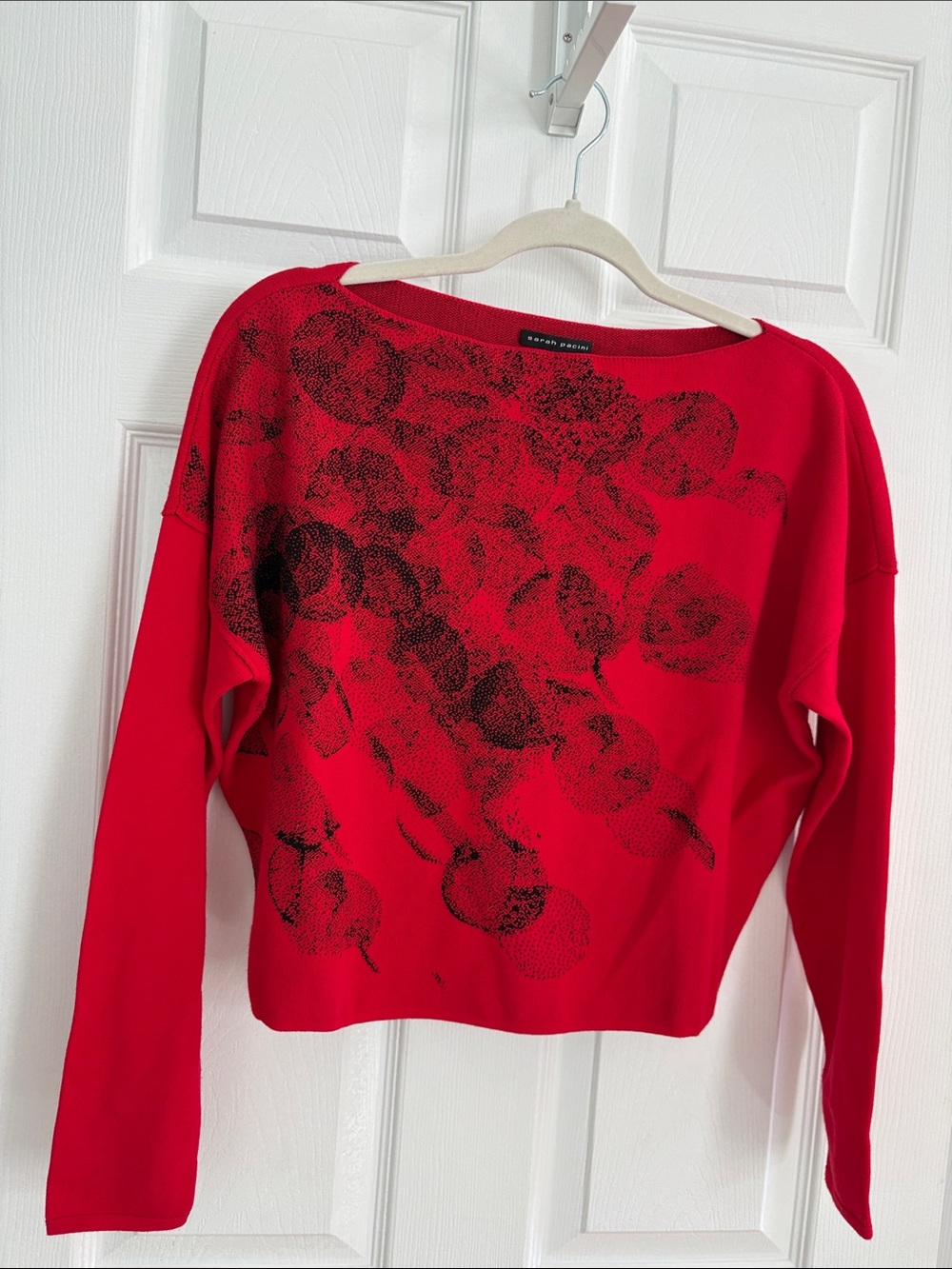 Sarah Pacini Red Off-Shoulder Sweater with Black Print